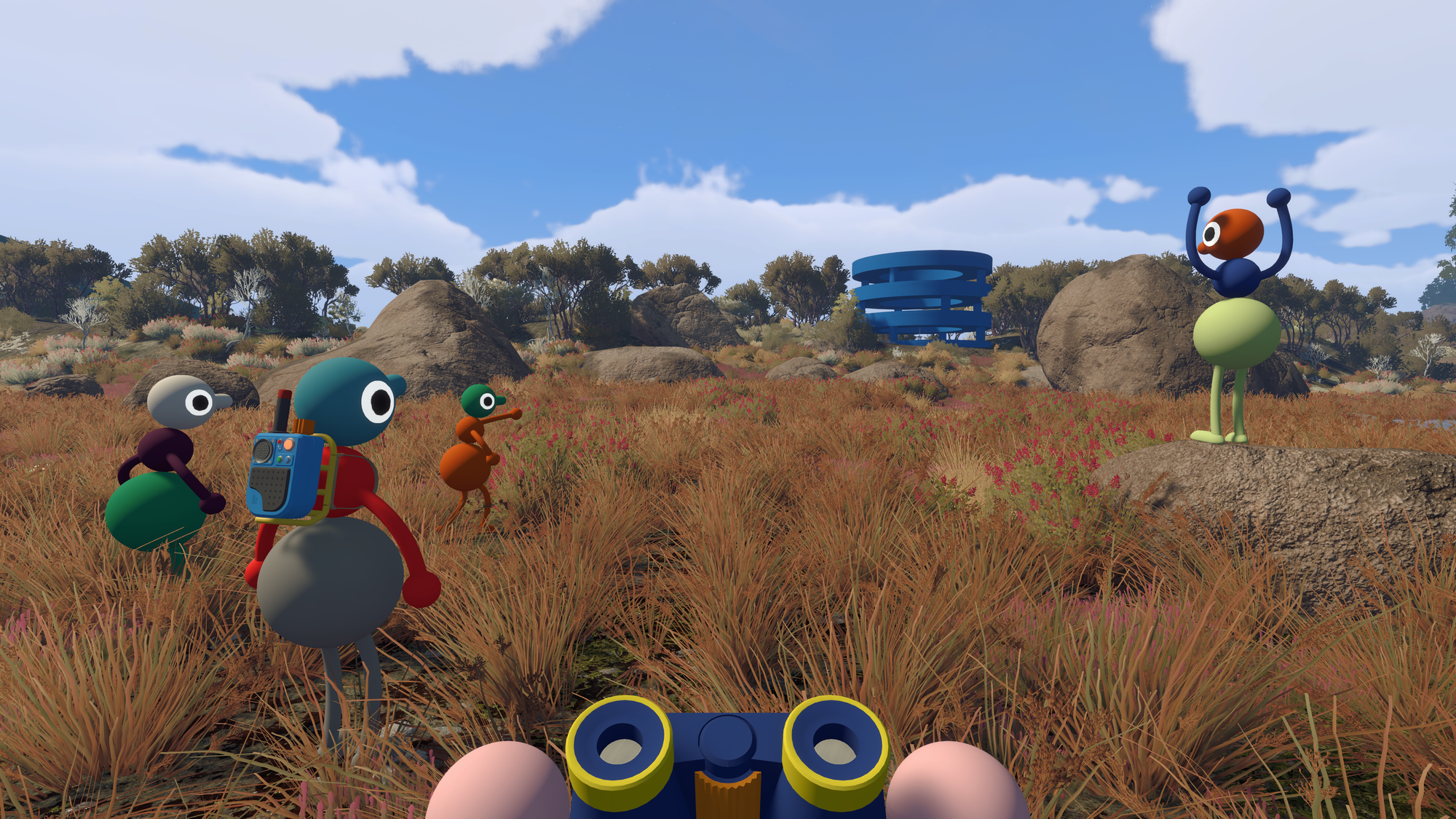 Players in a field, holding multiple items (from House House press kit)